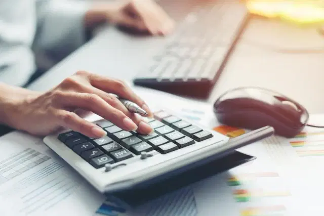 Image of bookkeeper calculating finances